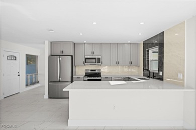 Beautifully updated pool home located on a golf course, offering on Rotonda Golf and Country Club The Hills Course in Florida - for sale on GolfHomes.com, golf home, golf lot