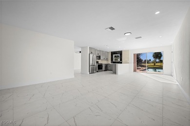 Beautifully updated pool home located on a golf course, offering on Rotonda Golf and Country Club The Hills Course in Florida - for sale on GolfHomes.com, golf home, golf lot