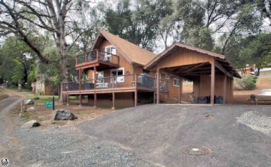 CLASSIC MOUNTAIN CABIN located inside the gated Yosemite for sale on GolfHomes.com