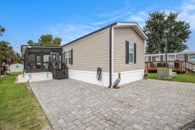 Welcome to this two-bedroom, two-bathroom home in the Waterway on Barefoot Resort and Golf Club  in South Carolina - for sale on GolfHomes.com, golf home, golf lot