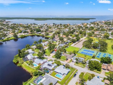Welcome to 5523 18th St. NE, where elevated living meets on Mangrove Bay Golf Course in Florida - for sale on GolfHomes.com, golf home, golf lot