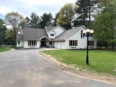 Introducing an exquisite 5-bedroom, 4-bathroom family residence on Timber Ridge Golf Club in Wisconsin - for sale on GolfHomes.com, golf home, golf lot