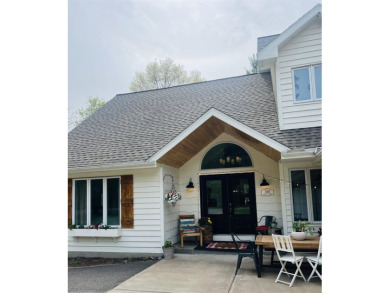 Introducing an exquisite 5-bedroom, 4-bathroom family residence on Timber Ridge Golf Club in Wisconsin - for sale on GolfHomes.com, golf home, golf lot