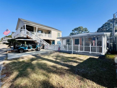 SURF SHACK BEACH HOUSE IN OCEAN LAKES WITH ABUNDANT OUTDOOR on Prestwick Country Club in South Carolina - for sale on GolfHomes.com, golf home, golf lot