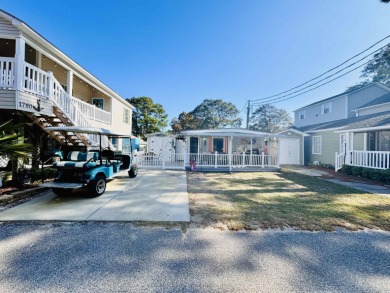 SURF SHACK BEACH HOUSE IN OCEAN LAKES WITH ABUNDANT OUTDOOR on Prestwick Country Club in South Carolina - for sale on GolfHomes.com, golf home, golf lot