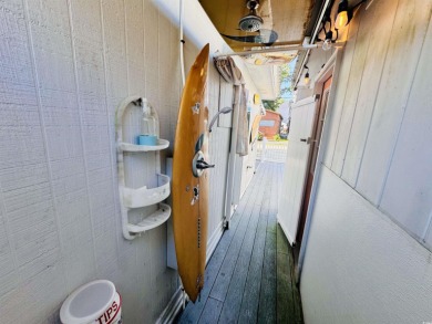SURF SHACK BEACH HOUSE IN OCEAN LAKES WITH ABUNDANT OUTDOOR on Prestwick Country Club in South Carolina - for sale on GolfHomes.com, golf home, golf lot