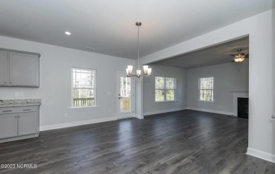 Welcome to 1430 Mona Passage Court, a delightful two-story home on Harbour Point Golf Club in North Carolina - for sale on GolfHomes.com, golf home, golf lot