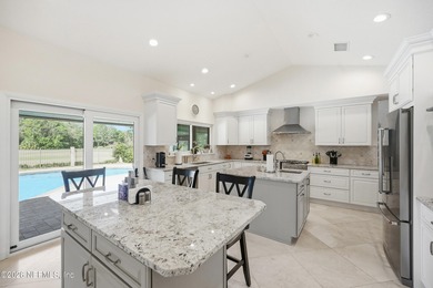 Vaulted ceilings and sunlit interiors define this elegant on The Deerwood Country Club in Florida - for sale on GolfHomes.com, golf home, golf lot