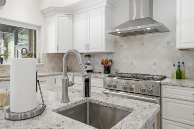 Vaulted ceilings and sunlit interiors define this elegant on The Deerwood Country Club in Florida - for sale on GolfHomes.com, golf home, golf lot