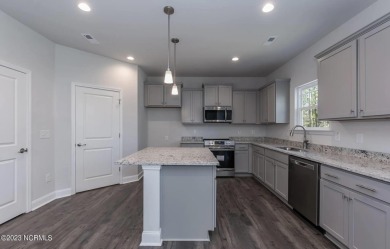 Welcome to 1430 Mona Passage Court, a delightful two-story home on Harbour Point Golf Club in North Carolina - for sale on GolfHomes.com, golf home, golf lot