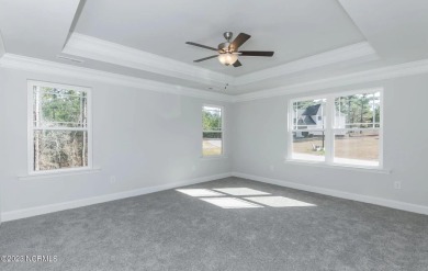 Welcome to 1430 Mona Passage Court, a delightful two-story home on Harbour Point Golf Club in North Carolina - for sale on GolfHomes.com, golf home, golf lot