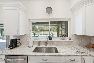 Vaulted ceilings and sunlit interiors define this elegant on The Deerwood Country Club in Florida - for sale on GolfHomes.com, golf home, golf lot