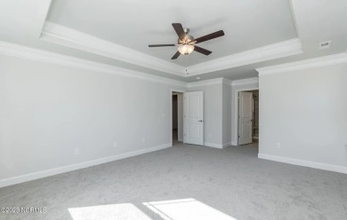 Welcome to 1430 Mona Passage Court, a delightful two-story home on Harbour Point Golf Club in North Carolina - for sale on GolfHomes.com, golf home, golf lot