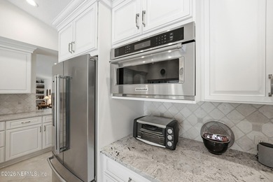 Vaulted ceilings and sunlit interiors define this elegant on The Deerwood Country Club in Florida - for sale on GolfHomes.com, golf home, golf lot