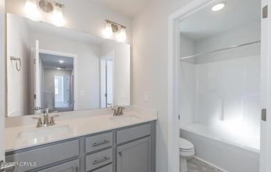 Welcome to 1430 Mona Passage Court, a delightful two-story home on Harbour Point Golf Club in North Carolina - for sale on GolfHomes.com, golf home, golf lot