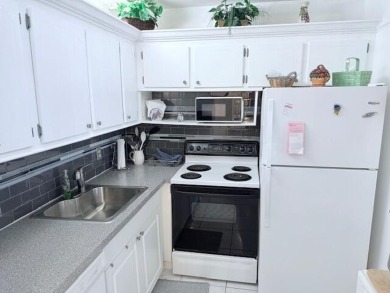 Lovely furnished 1 bedroom 1.5 bath unit in quiet location near on Hillsboro Pines Golf in Florida - for sale on GolfHomes.com, golf home, golf lot