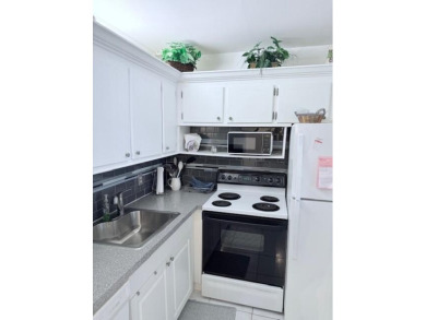 Lovely furnished 1 bedroom 1.5 bath unit in quiet location near on Hillsboro Pines Golf in Florida - for sale on GolfHomes.com, golf home, golf lot