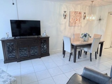 Lovely furnished 1 bedroom 1.5 bath unit in quiet location near on Hillsboro Pines Golf in Florida - for sale on GolfHomes.com, golf home, golf lot
