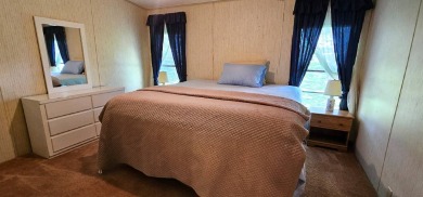 Furnished, spacious 2 bedroom 2 bath home in 55 + Resort style on Zephyrhills Municipal Golf Course in Florida - for sale on GolfHomes.com, golf home, golf lot