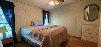 Furnished, spacious 2 bedroom 2 bath home in 55 + Resort style on Zephyrhills Municipal Golf Course in Florida - for sale on GolfHomes.com, golf home, golf lot