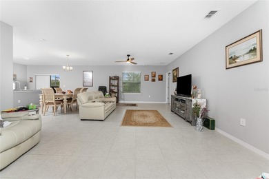 Impressive and spacious 4 Bedroom, 2 Bathroom home with attached on Deep Creek Golf Club in Florida - for sale on GolfHomes.com, golf home, golf lot