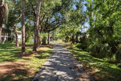 Nestled within the lush, park-like setting of The Meadows in on The Meadows Golf and Country Club in Florida - for sale on GolfHomes.com, golf home, golf lot
