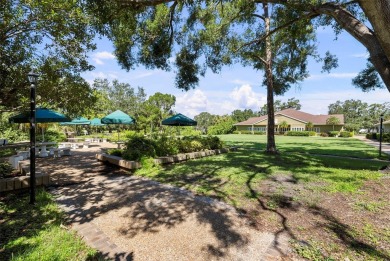 Nestled within the lush, park-like setting of The Meadows in on The Meadows Golf and Country Club in Florida - for sale on GolfHomes.com, golf home, golf lot