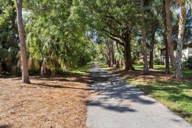 Nestled within the lush, park-like setting of The Meadows in on The Meadows Golf and Country Club in Florida - for sale on GolfHomes.com, golf home, golf lot