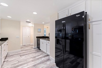 Back on the market with a NEW PRICE, A NEW LOOK AND A BEAUTIFUL on Isla Del Sol Yacht and Country Club in Florida - for sale on GolfHomes.com, golf home, golf lot