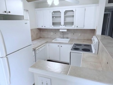 1st floor corner 2 bedroom,2 bath quiet Tilford location on Hillsboro Pines Golf in Florida - for sale on GolfHomes.com, golf home, golf lot
