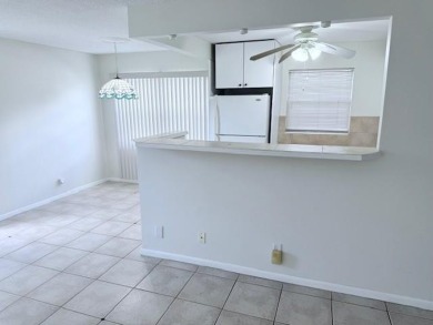 1st floor corner 2 bedroom,2 bath quiet Tilford location on Hillsboro Pines Golf in Florida - for sale on GolfHomes.com, golf home, golf lot