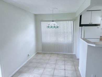 1st floor corner 2 bedroom,2 bath quiet Tilford location on Hillsboro Pines Golf in Florida - for sale on GolfHomes.com, golf home, golf lot
