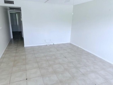 1st floor corner 2 bedroom,2 bath quiet Tilford location on Hillsboro Pines Golf in Florida - for sale on GolfHomes.com, golf home, golf lot