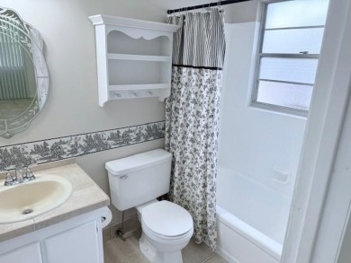 1st floor corner 2 bedroom,2 bath quiet Tilford location on Hillsboro Pines Golf in Florida - for sale on GolfHomes.com, golf home, golf lot