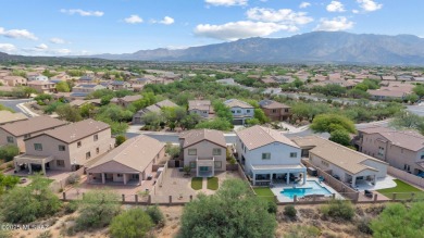 Located in Rancho Vistoso, this Elevation C Plan with Stone sits on The Golf Club at Vistoso in Arizona - for sale on GolfHomes.com, golf home, golf lot