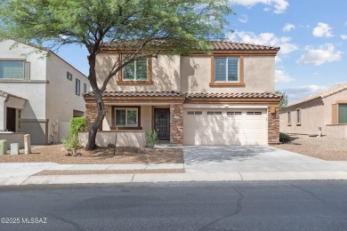 Located in Rancho Vistoso, this Elevation C Plan with Stone sits on The Golf Club at Vistoso in Arizona - for sale on GolfHomes.com, golf home, golf lot