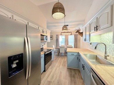 Charming One-Level DUPLEX just a mile from the beach! Looking on True Blue Plantation in South Carolina - for sale on GolfHomes.com, golf home, golf lot