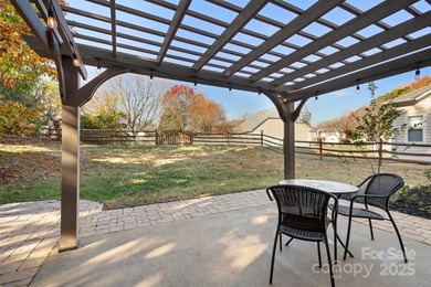 This beautifully-maintained 4-bedroom home with a welcoming on The Peninsula Club in North Carolina - for sale on GolfHomes.com, golf home, golf lot