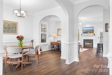 This beautifully-maintained 4-bedroom home with a welcoming on The Peninsula Club in North Carolina - for sale on GolfHomes.com, golf home, golf lot