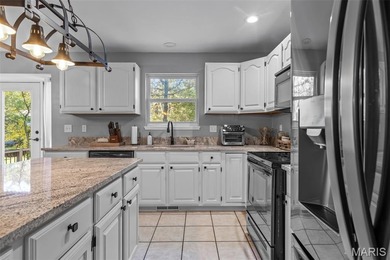 Beautifully updated 2,600 +/- Sq Ft 4 Bedroom, 3 Bathroom home on Raintree Country Club in Missouri - for sale on GolfHomes.com, golf home, golf lot