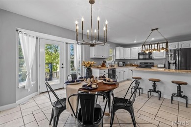 Beautifully updated 2,600 +/- Sq Ft 4 Bedroom, 3 Bathroom home on Raintree Country Club in Missouri - for sale on GolfHomes.com, golf home, golf lot