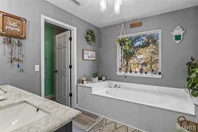 Beautifully updated 2,600 +/- Sq Ft 4 Bedroom, 3 Bathroom home on Raintree Country Club in Missouri - for sale on GolfHomes.com, golf home, golf lot