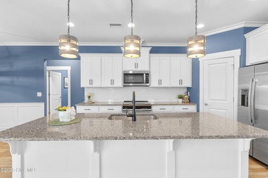 Begin your next chapter in this beautifully maintained home on Members Club At St. James Plantation in North Carolina - for sale on GolfHomes.com, golf home, golf lot