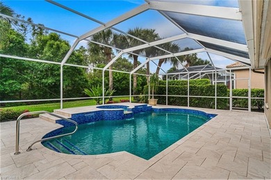Sun-drenched southern exposure, a stunning updated pool, and on Shadow Wood Country Club in Florida - for sale on GolfHomes.com, golf home, golf lot