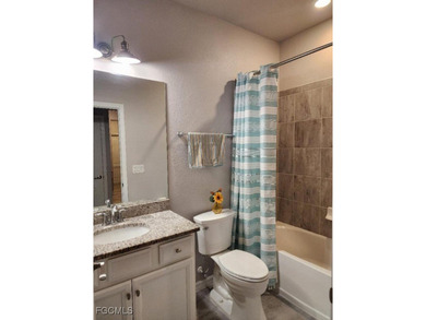 Charming 3-Bedroom, 3-Bath Lake View Home with Assumable FHA on River Hall Country Club in Florida - for sale on GolfHomes.com, golf home, golf lot