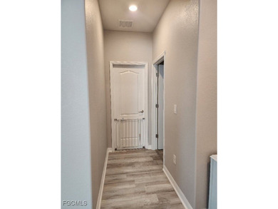 Charming 3-Bedroom, 3-Bath Lake View Home with Assumable FHA on River Hall Country Club in Florida - for sale on GolfHomes.com, golf home, golf lot