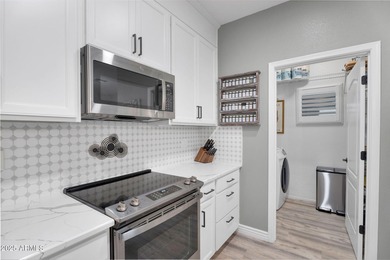 Welcome home to this beautifully upgraded residence located in on The Golf Club At Johnson Ranch in Arizona - for sale on GolfHomes.com, golf home, golf lot