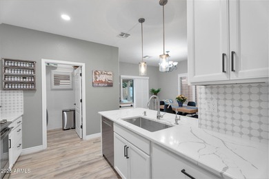 Welcome home to this beautifully upgraded residence located in on The Golf Club At Johnson Ranch in Arizona - for sale on GolfHomes.com, golf home, golf lot