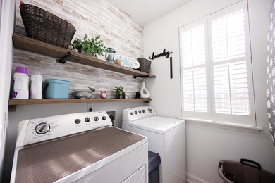 Welcome to the former model home of the reputable John Wieland on Dunes West Golf Club in South Carolina - for sale on GolfHomes.com, golf home, golf lot