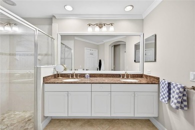 Tastefully updated first floor coach home is now available in on Pelican Sound Golf and River Club in Florida - for sale on GolfHomes.com, golf home, golf lot